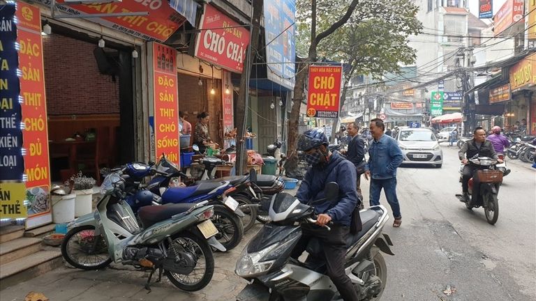 Eateries across a dog meat street in Vietnam. | Source: Lao Dong