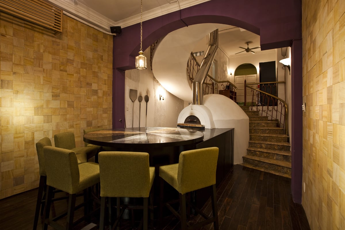 The first Pizza 4P’s completed in 2011 with a round table where customers could take in the pizza-making process sizesmaxwidth 1200px 100vw 1200px The first Pizza 4Prsquos completed in 2011 with a round table where customers could take in the pizzamaking process