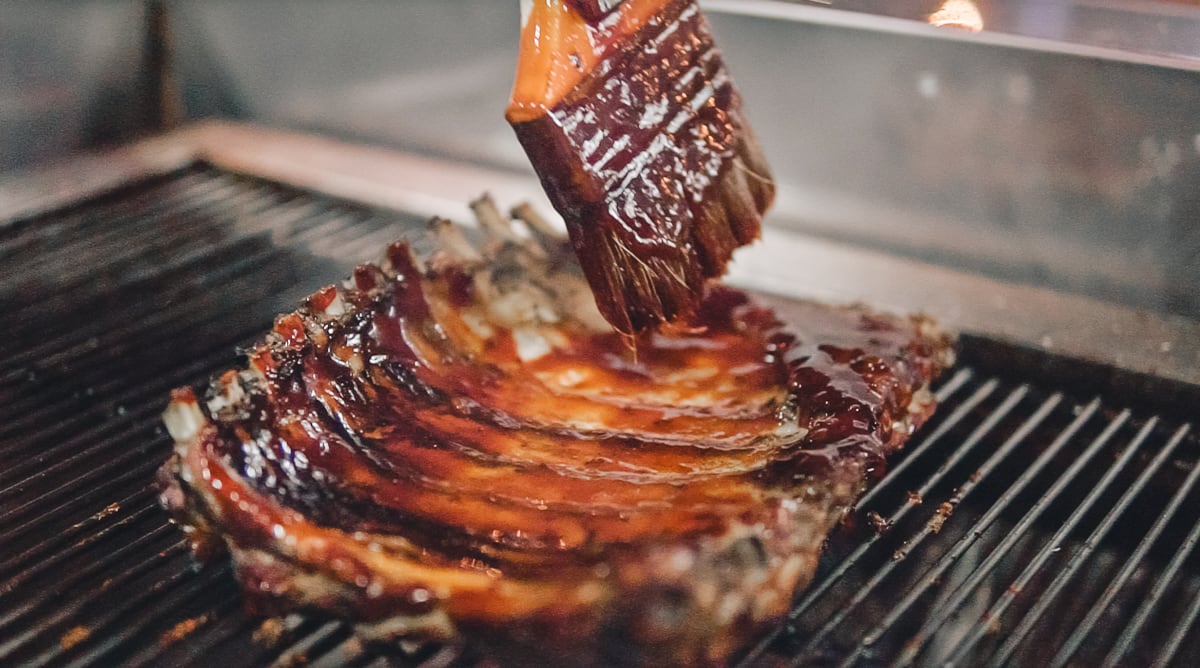 After the Korean Gochujang Pork Ribs are smoked chef Tony lathers on a thick layer of sauce with components of both American and Korean barbecue sauces The Anatomy Of A Dish Quan Ut Uts Spicy Gochujang Pork Ribs4